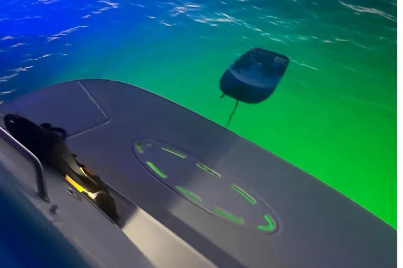 Slide: The Image of 2005 Sea Ray 320 Sundancer boat with vibrant underwater lighting. - 16