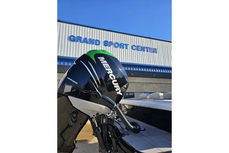 Slide: The Image of 2014 Concept 36' CC boat with Mercury engine on trailer, vibrant blue and green design. - 10