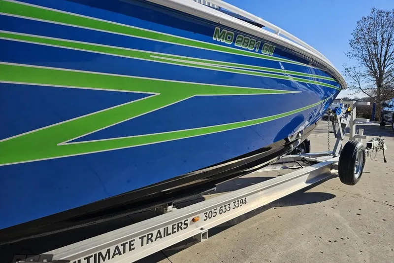 Slide: The Image of 2014 Concept 36' CC boat displayed outside a dealership under clear blue skies. - 12