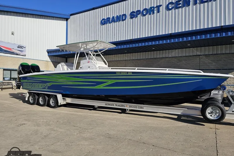 Slide: The Image of 2014 Concept 36' CC boat with vibrant blue and green graphics. - 13