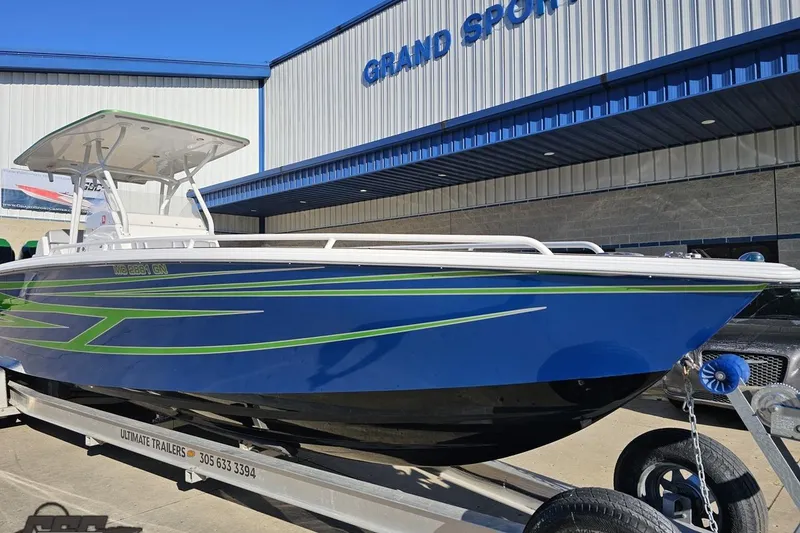Slide: The Image of 2014 Concept 36' CC boat with blue and green design on trailer. - 14