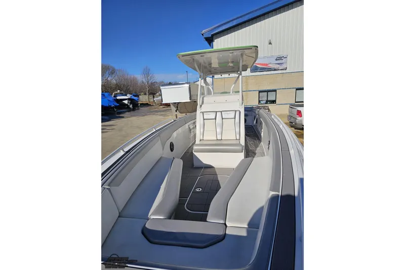 Slide: The Image of 2014 Concept 36' CC boat on trailer, blue and green design, parked outside Grand Sport Center. - 16