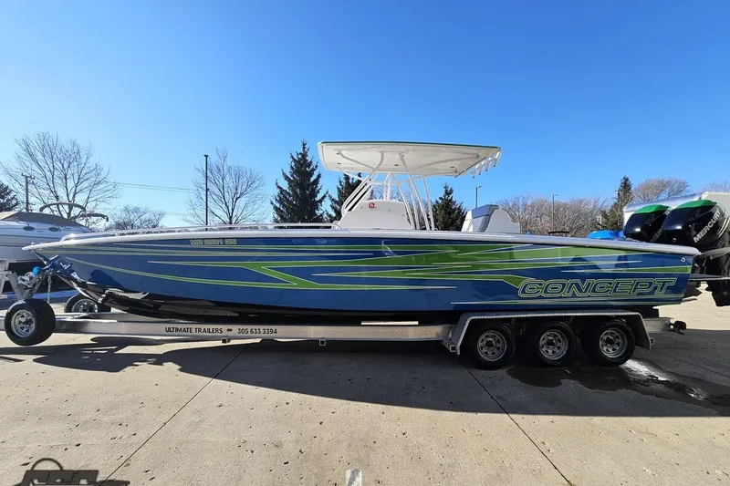 Slide: The Image of 2014 Concept 36' CC boat in a marina, showcasing sleek design and spacious deck. - 19