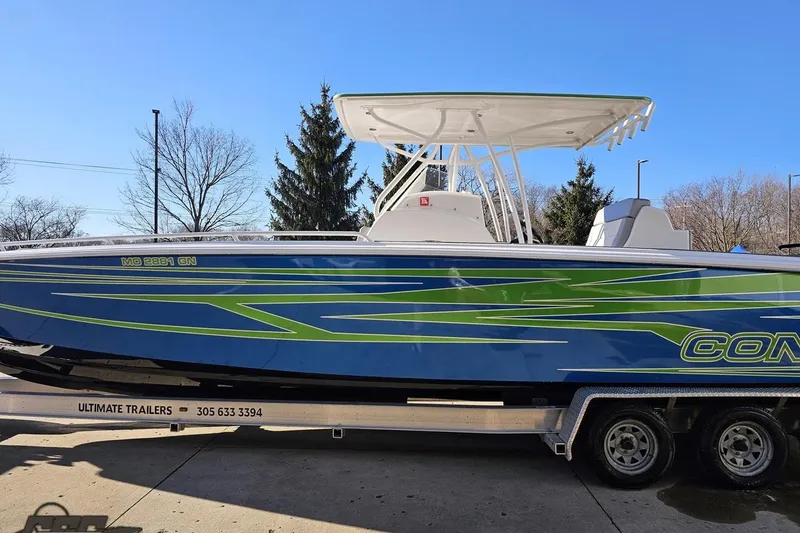 Slide: The Image of 2014 Concept 36' CC boat with spacious seating and modern design in a marina setting. - 20