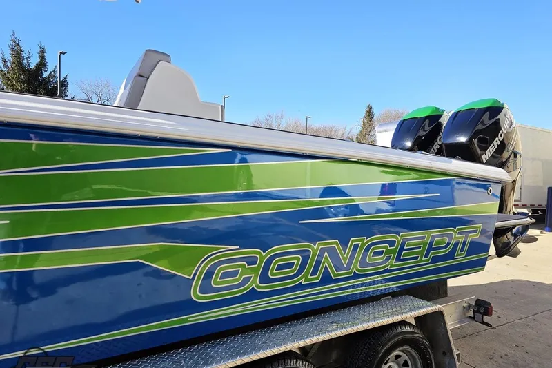 Slide: The Image of Blue 2014 Concept 36' CC boat on trailer, featuring green accents. - 21