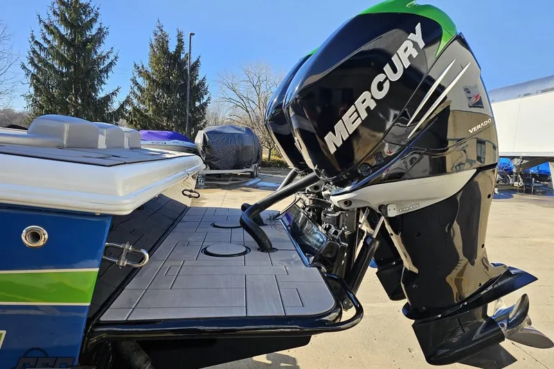 Slide: The Image of 2014 Concept 36' CC boat on trailer, blue and green design, parked outdoors. - 25