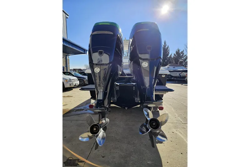 Slide: The Image of 2014 Concept 36' CC boat with vibrant blue and green design on a trailer. - 26