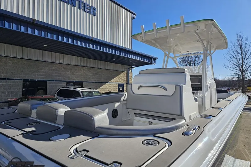 Slide: The Image of 2014 Concept 36' CC boat with blue and green design on trailer. - 27