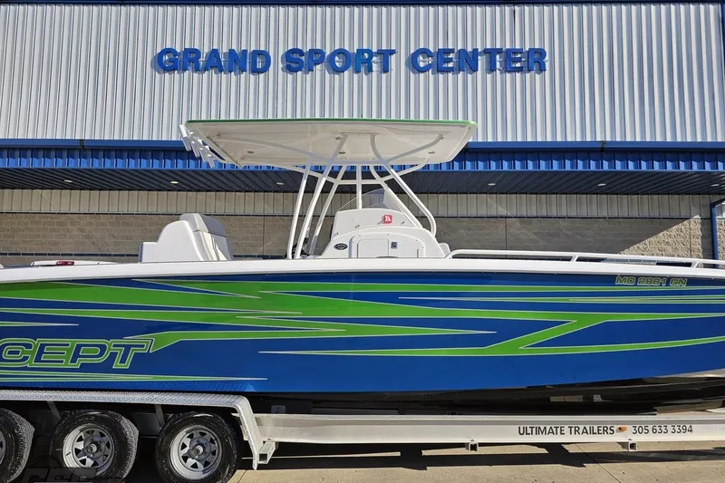 Slide: The Image of 2014 Concept 36' CC boat with vibrant blue and green design at Grand Sport Center. - 3