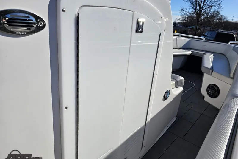 Slide: The Image of 2014 Concept 36' CC boat with vibrant blue and green design on trailer. - 33