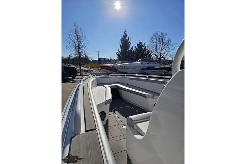 Slide: The Image of 2014 Concept 36' CC boat on trailer, vibrant blue and green design, sunny day. - 35