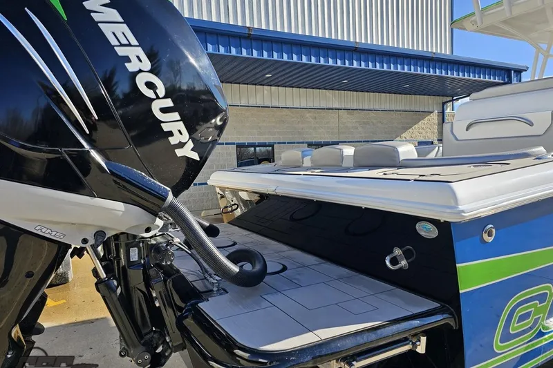 Slide: The Image of 2014 Concept 36' CC boat with Mercury engine, docked near a building. - 45