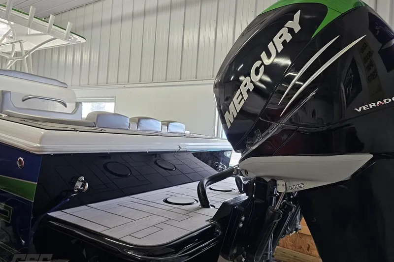 Slide: The Image of 2014 Concept 36' CC boat with Mercury Verado engine in a garage setting. - 46