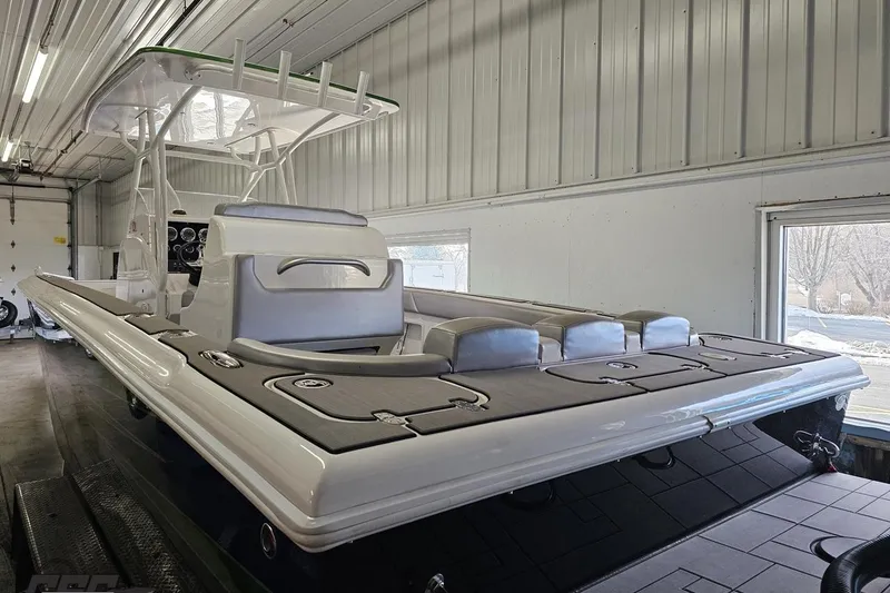 Slide: The Image of 2014 Concept 36' CC boat in a garage, showcasing sleek design and modern features. - 48