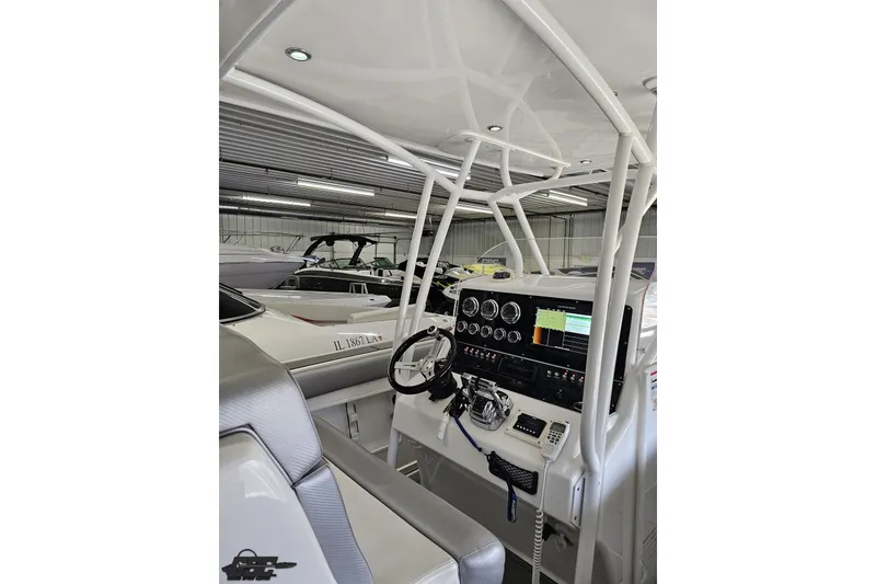 Slide: The Image of Interior view of 2014 Concept 36' CC boat with modern dashboard and controls. - 56