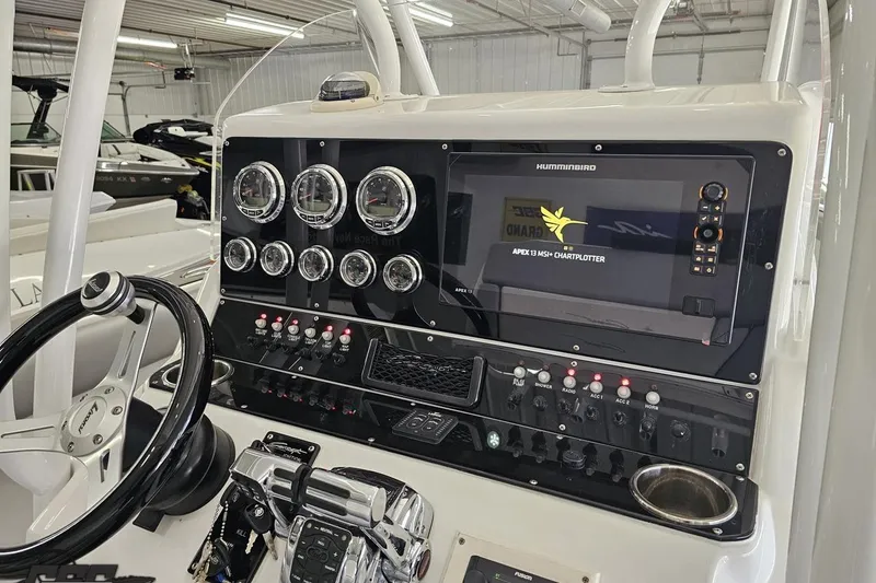Slide: The Image of Control panel of 2014 Concept 36' CC boat with Humminbird chartplotter and gauges. - 60