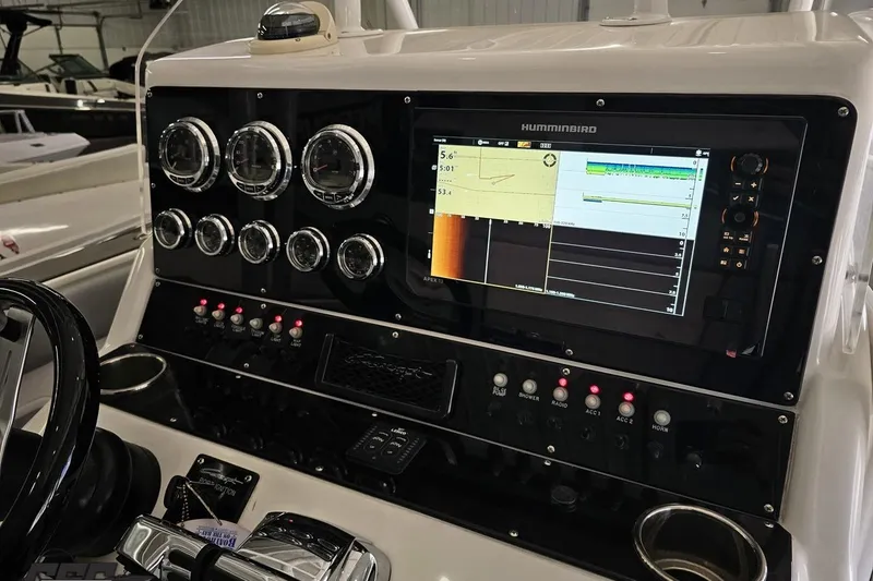 Slide: The Image of Control panel of 2014 Concept 36' CC boat with gauges and Humminbird display. - 62
