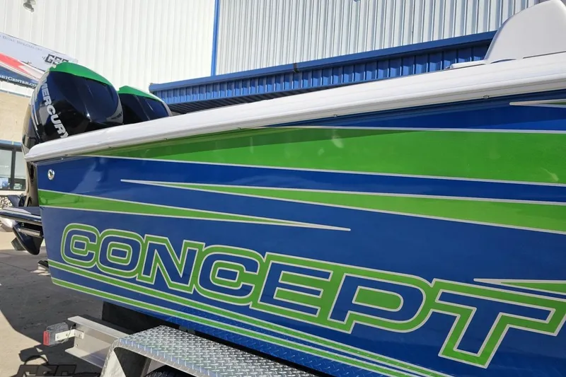 Slide: The Image of 2014 Concept 36' CC boat with blue and green design on trailer. - 7