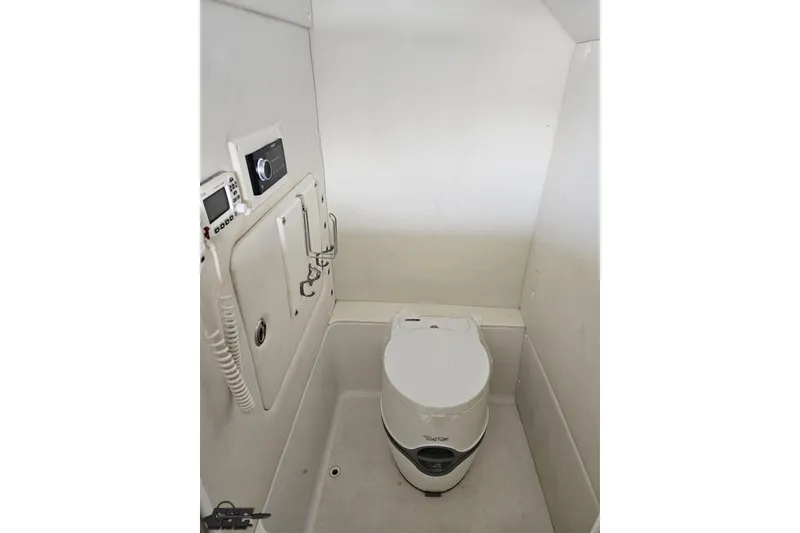 Slide: The Image of Compact marine bathroom in 2014 Concept 36' CC boat, featuring a portable toilet and control panel. - 72