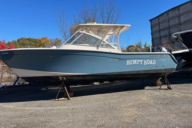 The Image of 2011 Grady-White Freedom 307 boat named "Bumpy Road" on dry land. - 0