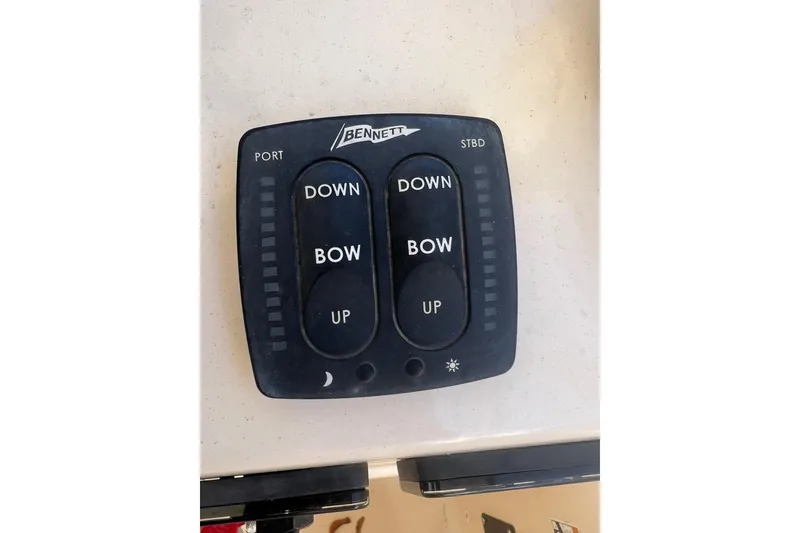 Slide: The Image of Bennett trim tab control panel on 2011 Grady-White Freedom 307 boat. - 11
