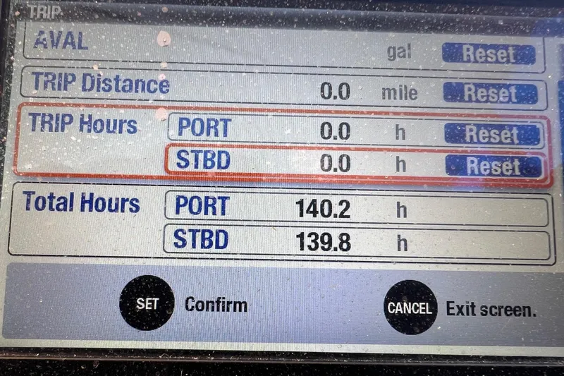 Slide: The Image of Boat dashboard display showing trip and total hours for Grady-White Freedom 307, 2011 model. - 13