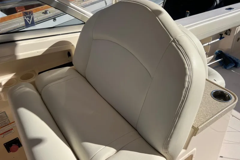 Slide: The Image of Luxurious seating on 2011 Grady-White Freedom 307 boat with cup holder. - 4