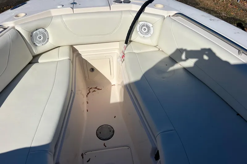 Slide: The Image of Interior of 2011 Grady-White Freedom 307 boat with white seating and speakers. - 5