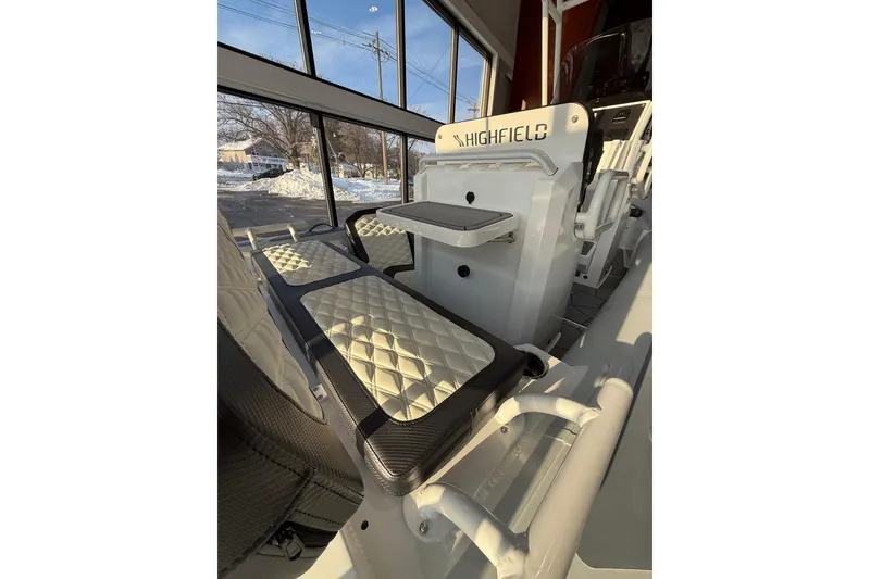 Slide: The Image of 2026 Highfield Sport 560 boat interior with quilted seating and modern design. - 3
