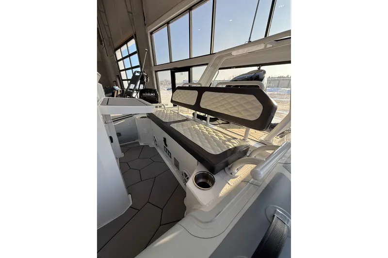 Slide: The Image of 2026 Highfield Sport 560 boat interior with quilted seating and modern design. - 9
