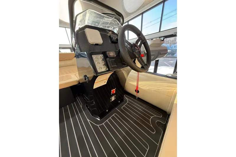 Slide: The Image of Interior view of 2026 Highfield Sport 420 boat, featuring steering wheel and control panel. - 7