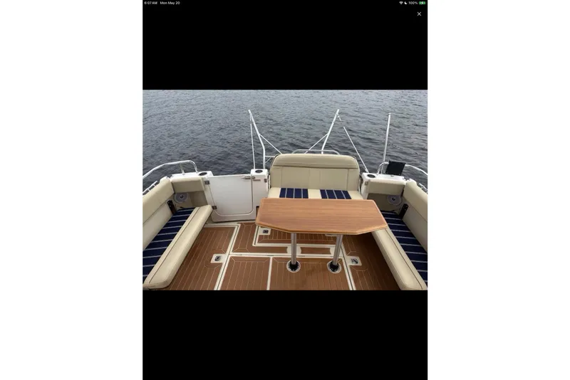 Slide: The Image of 2021 Ranger Tugs R-29 S boat deck with stainless steel railings on water. - 10