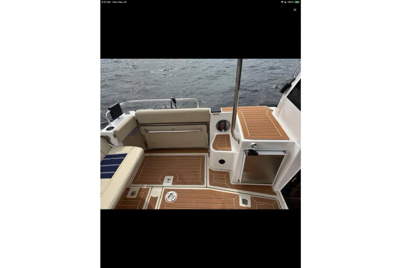 Slide: The Image of Luxurious interior of 2021 Ranger Tugs R-29 S boat with wood finishes and modern amenities. - 13