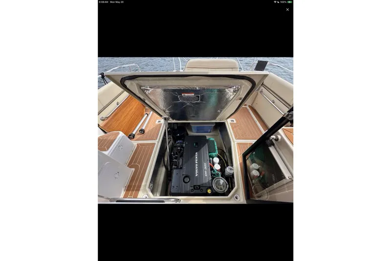 Slide: The Image of Interior of 2021 Ranger Tugs R-29 S boat with wooden table and seating. - 14