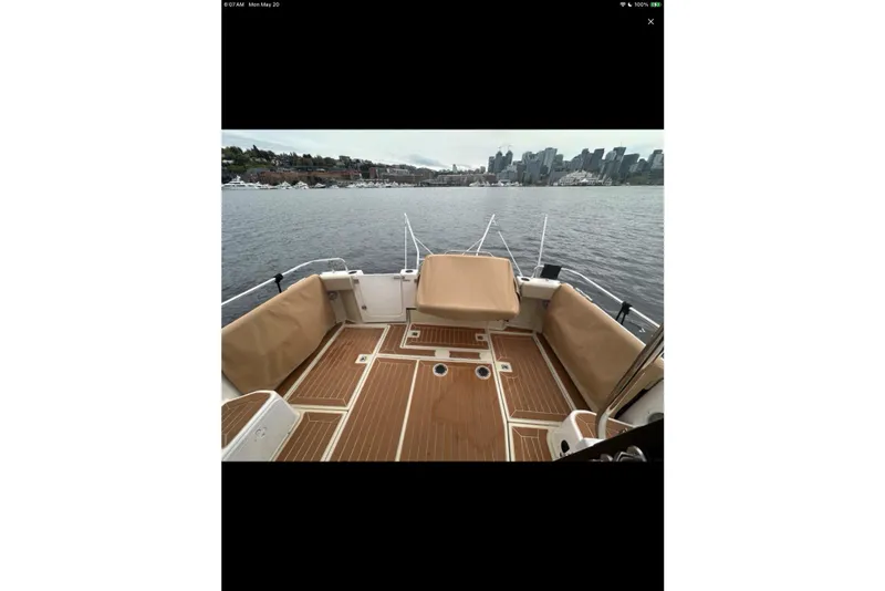 Slide: The Image of Interior of 2021 Ranger Tugs R-29 S with convertible seating and scenic water view. - 15