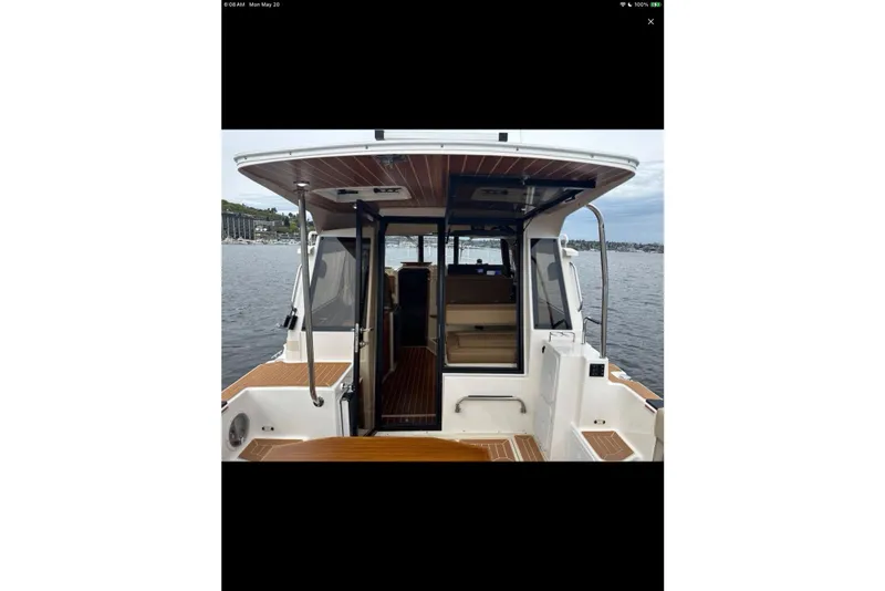 Slide: The Image of Open Dometic fridge inside 2021 Ranger Tugs R-29 S boat interior. - 18