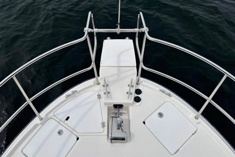 Slide: The Image of 2021 Ranger Tugs R-29 S boat on trailer in a garage setting. - 4