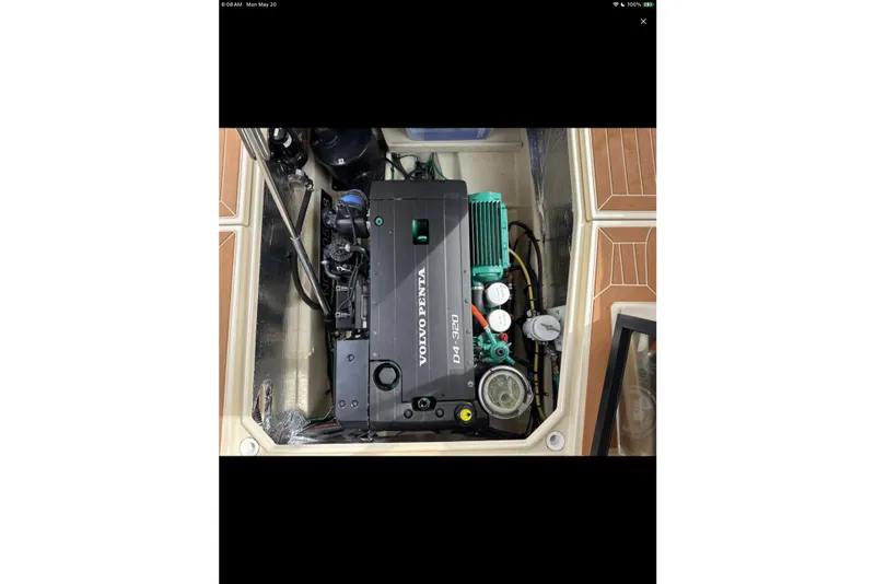 Slide: The Image of 2021 Ranger Tugs R-29 S boat deck with seating and wooden table. - 8