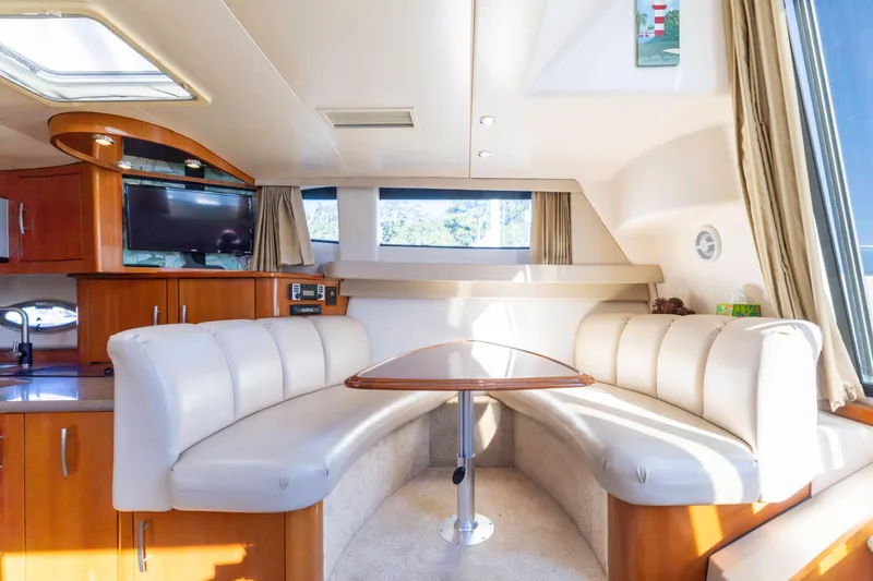 Slide: The Image of Luxurious interior of 2006 Carver 36 Mariner yacht with plush seating and modern amenities. - 13