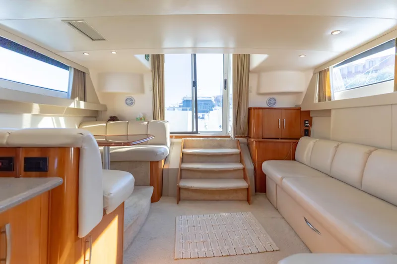 Slide: The Image of Luxurious interior of 2006 Carver 36 Mariner yacht with plush seating and elegant design. - 15