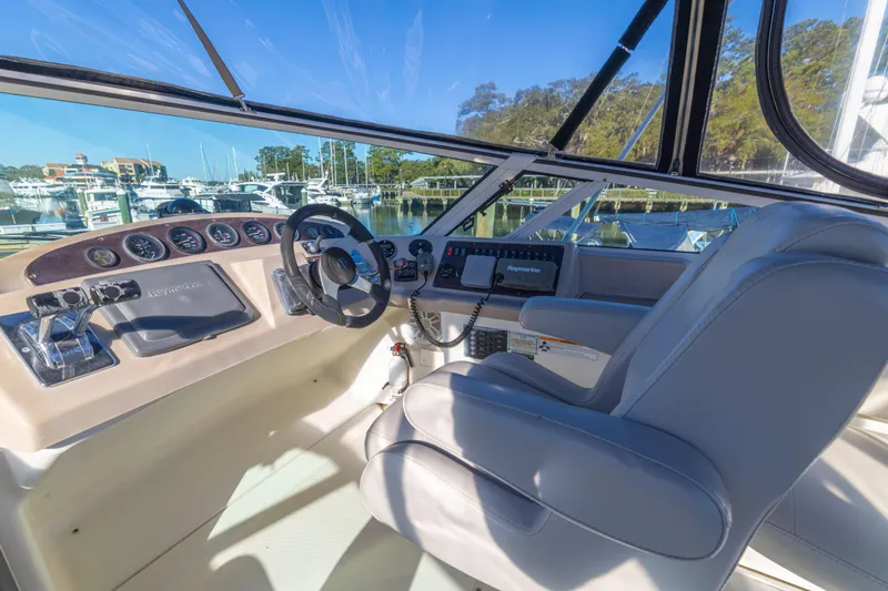 Slide: The Image of Interior cockpit of 2006 Carver 36 Mariner yacht with steering wheel and navigation controls. - 16