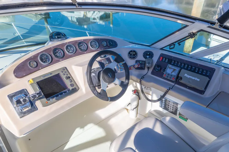 Slide: The Image of 2006 Carver 36 Mariner helm with navigation instruments and steering wheel. - 17