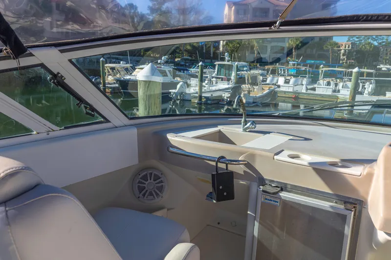 Slide: The Image of Interior view of 2006 Carver 36 Mariner yacht with marina background. - 18