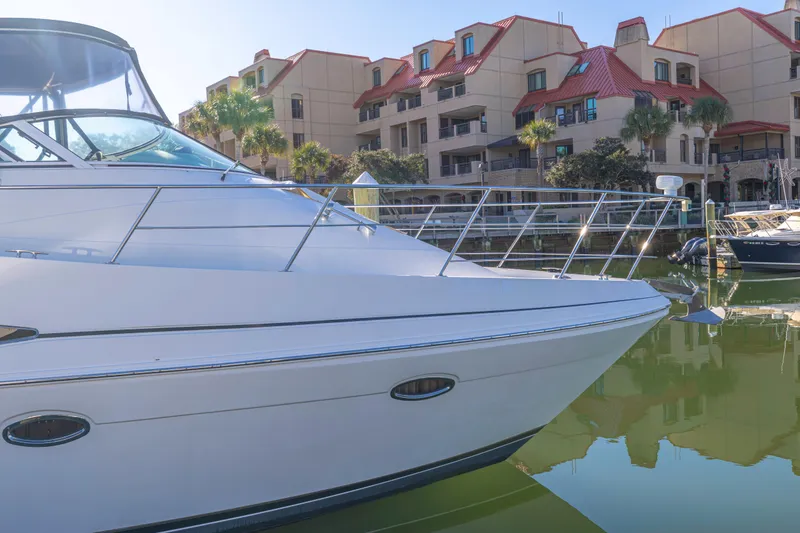 Slide: The Image of 2006 Carver 36 Mariner yacht docked near waterfront buildings. - 7