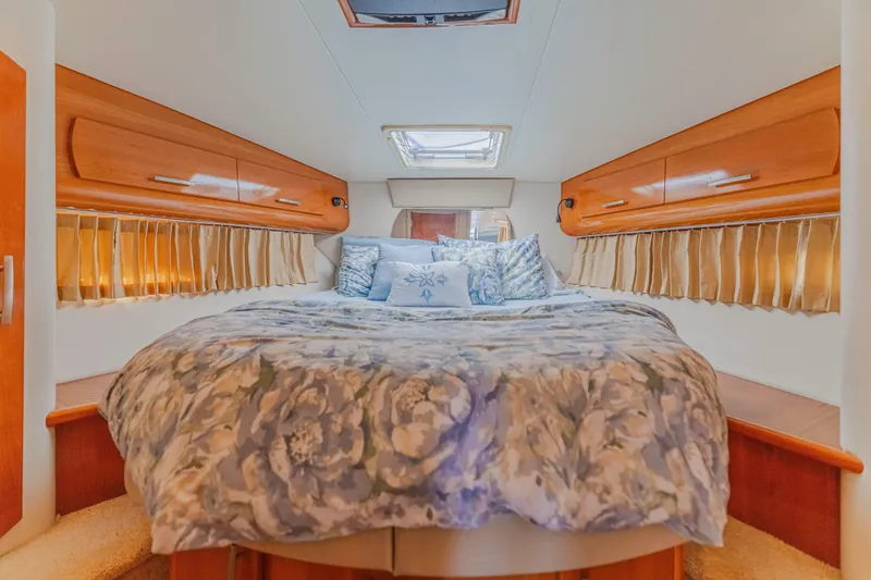 Slide: The Image of Luxurious bedroom interior of 2006 Carver 36 Mariner yacht with floral bedding. - 8