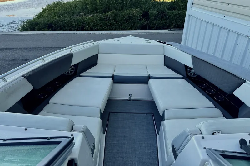 Slide: The Image of 2014 Regal 3200 Bowrider boat interior with spacious seating and cup holders. - 13