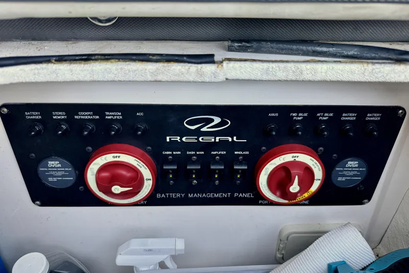 Slide: The Image of Battery management panel of 2014 Regal 3200 Bowrider boat with control switches. - 27