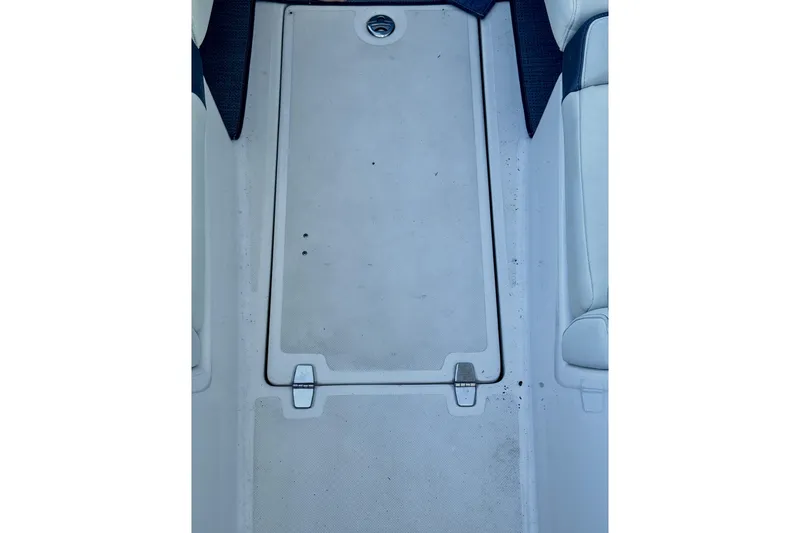 Slide: The Image of 2014 Regal 3200 Bowrider interior floor with storage compartment. - 30