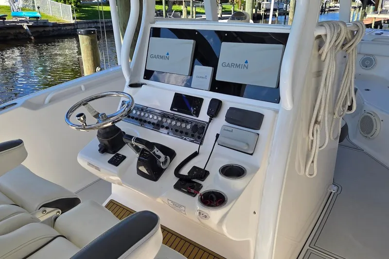Slide: The Image of Helm of 2015 Tidewater 280 CC Adventure with Garmin navigation system. - 12