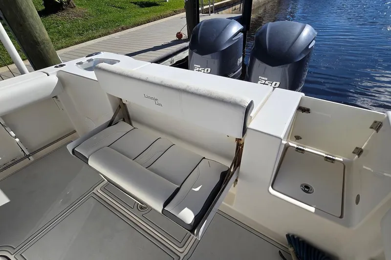 Slide: The Image of 2015 Tidewater 280 CC Adventure boat with Yamaha engines and foldable seating. - 13